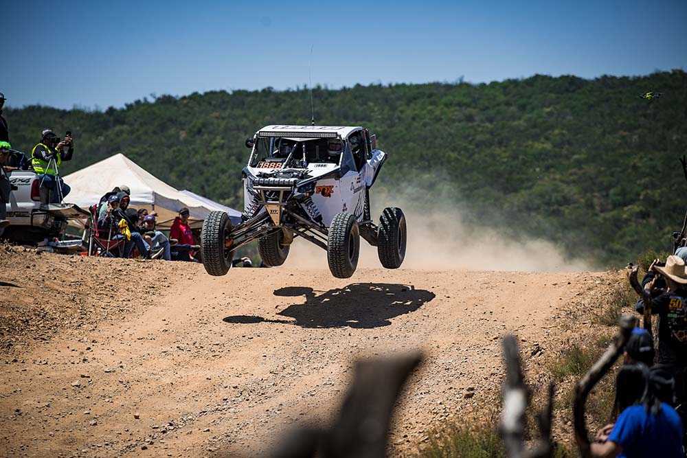 Samlex offroad UTV getting air on jump in desert NORRA 1000 race
